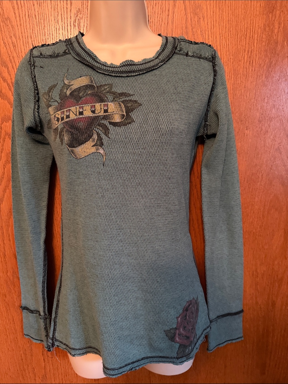 Sinful Sage Green Long Sleeve Graphic Tee with Vintage Tattoo Motif